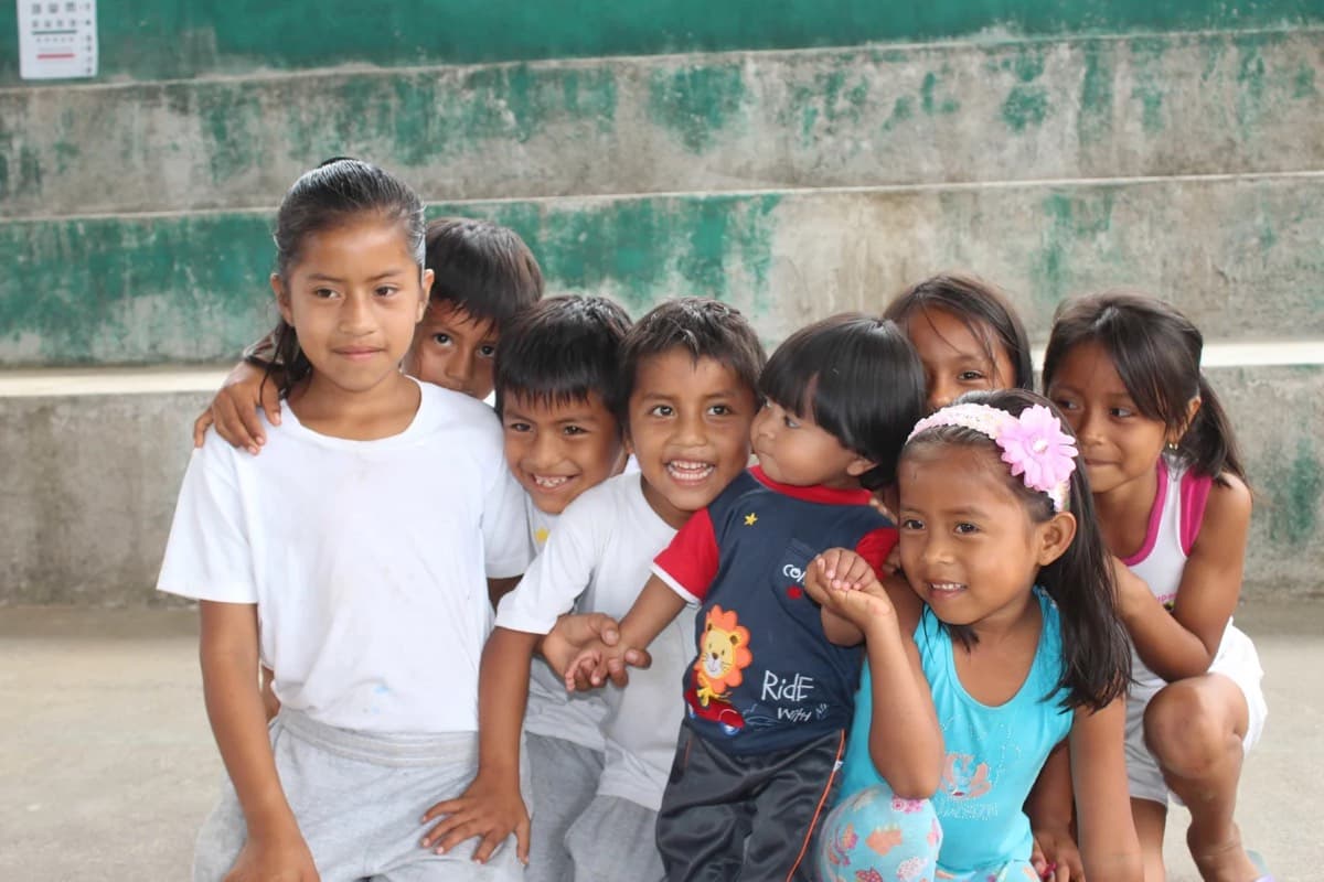 Children gathered together outside a community clinic