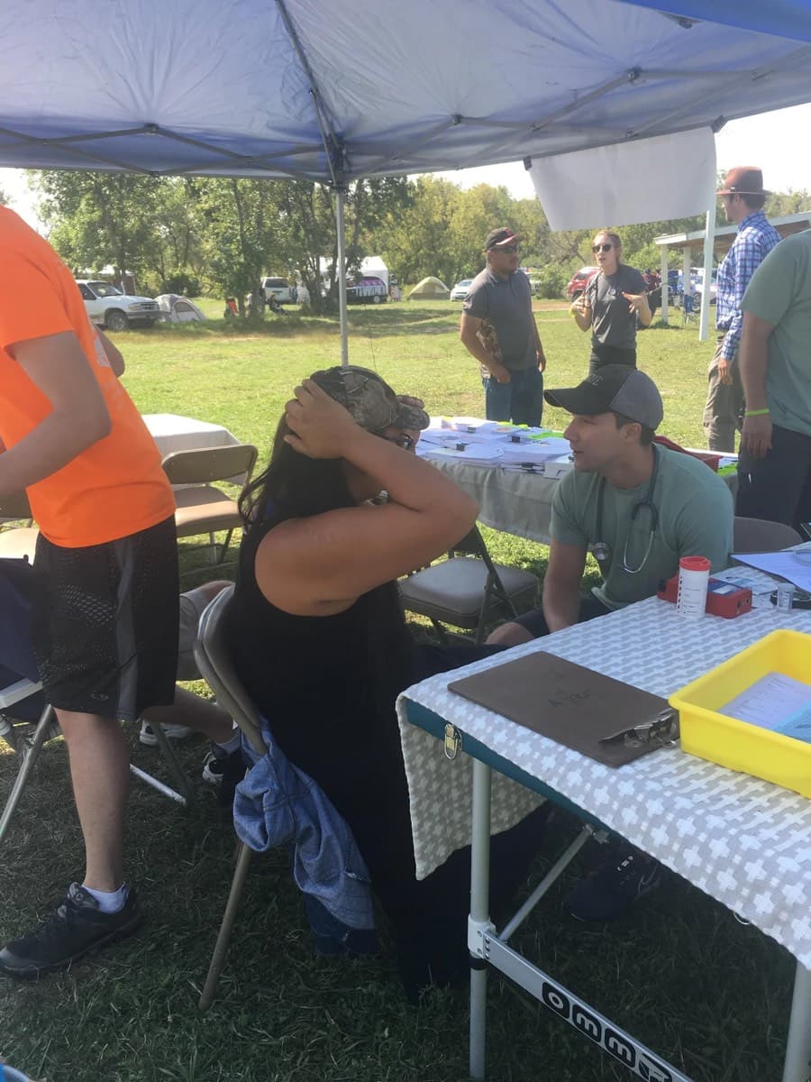 Health screening under way at a fair table
